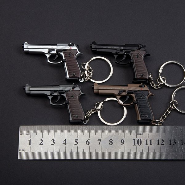 Nouveau arrivée créative 92f pistolet pistolet alliage alliage disassement mini métal keychain pendant miniature modèle 92f cadeaux d'anniversaire pour enfants clés 033
