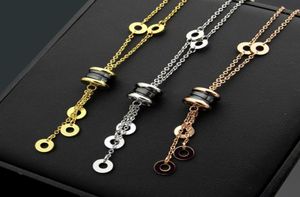 NIEUW ARBROEM MADE LADY TITANIUM Steel Tassels Lettering 18K PLated Gold Necklace With Black White Ceramic Spring Pendant Engageme9969821