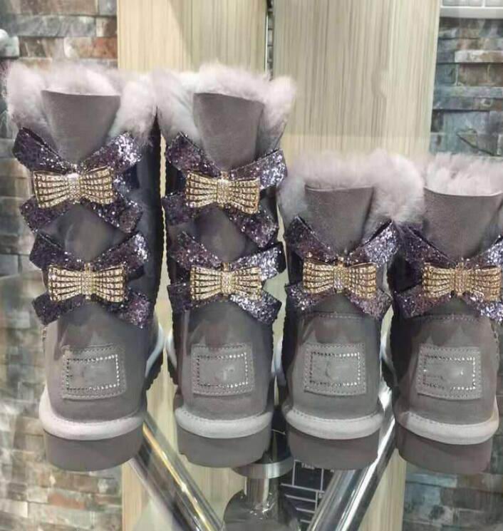 Nuevas botas de nieve australianas Zapatos de algodón de mujer cálidos de moda de tubo medio Bowknot drill snowshoe tamaño 8811