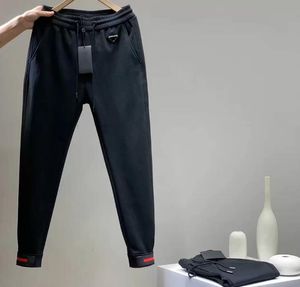 Nouveau automne hiver vêtements pour hommes pantalons pour hommes mode classique pantalon sexy pantalons de survêtement style européen américain broderie de lettre importée pantalon de pieds réglable A002