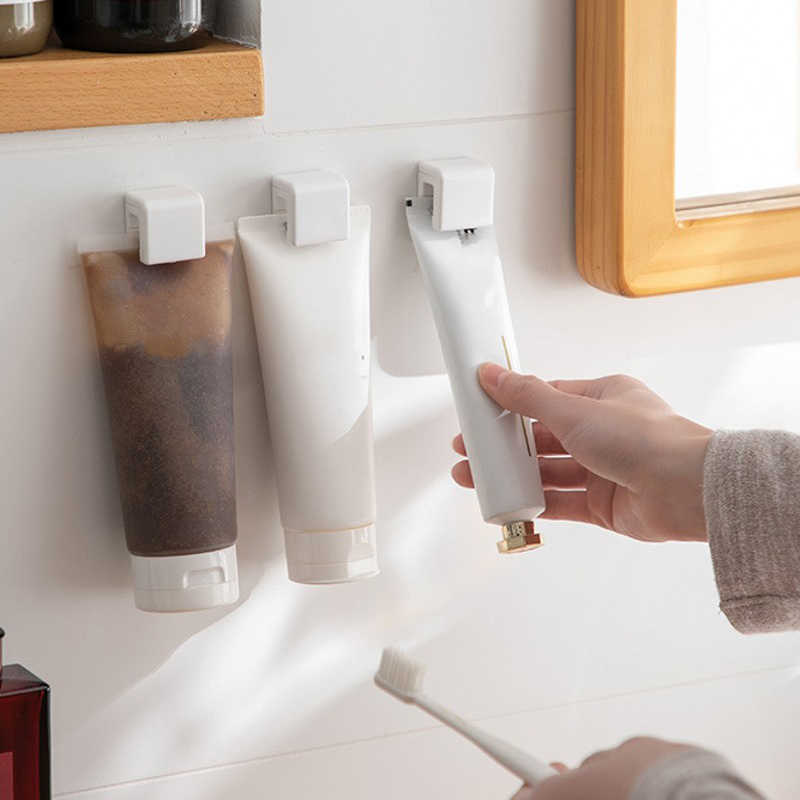 Nowy klip wiszący łazienki wielofunkcyjne pasty do zębów łazienki stojak do czyszczenia plastikowego pasty do zębów stojak na moc na ścianę organizator