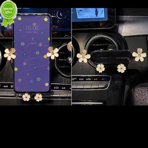 Nouveau support de téléphone de gravité de fleurs d'alliage de cristal de Bling pour le support de navigation d'évent de bâti de téléphone de voiture universel pour l'iphone Samsung