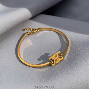 Nouveau bracelet en titane en acier plaqué 18k Gol French French Triumphal Arch Niche Design ne s'estompe pas