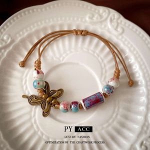 Nouveau papillon chinois Round perle en céramique tissé corde de conception de Chine-Chic Bracelet Net Ornement de main polyvalente rouge