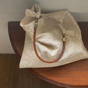 Nouveau sac de style chinois texturé en tissu gris en une pièce un sac indépendant en cuir à la corde en cuir à la corde à main sac à main