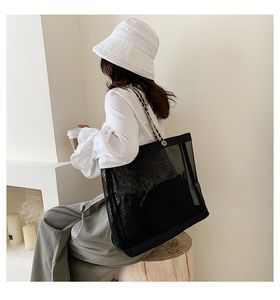 NOUVEAU Sac de chaîne en maille d'impression blanche classique avec ruban Sac de voyage de plage classique Sac de lavage pour femmes Étui en maille de rangement de maquillage cosmétique