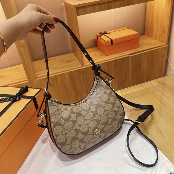 New Crescent Alta calidad Axila Minimalista Hombro de mujer Viajero Bolso de moda versátil 2024 Diseño Moda 78% de descuento en tienda al por mayor