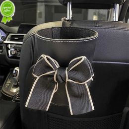 Nouveau mignon Bowknot voiture poubelle peut pour siège arrière appui-tête Mini sortie automatique évent organisateur sac à ordures boîte de rangement à ordures seau