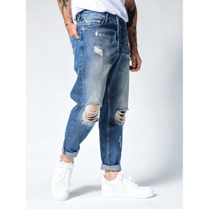 Nouveau pantalon pour hommes avec des manches droites et des trous à la mode, un jean ajusté bleu pour hommes M511 50