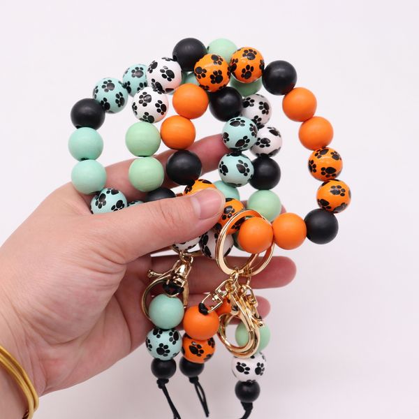 Nouveau design Bracelet perlé en bois Personnalisé et créatif multi-couleurs motif de patte de chien Bracelet Print Keynchain en gros