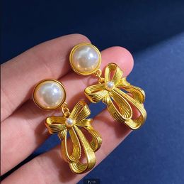 Nouveaux rubans en métal conçus arcs boucles d'oreilles pour femmes de style rétro boucle d'oreille de luxe bijoux de créateur E54