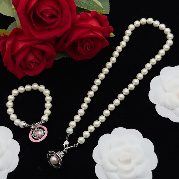 Nouveau collier de perle conçu rose couleur émail couleur saturne producteurs femmes en cristal de sécurité orbe de sécurité motif de mariage bijoux de mariage bijoux de créateurs n0240