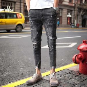 Nieuwe noodlijdende jeans voor mannen, 9-punts jeans met noodlijdende zoom, Koreaanse versie slanke fit en kleine voettrend, bedelaars casual broek voor mannen