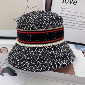 Nieuwe elegante brief emmer visser strohoed vrouwelijke lente-reis zonneschad in Japanse stijl en internet-beroemde zwart-witte zonbescherming hoeden