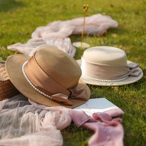 Nieuwe elegante Pearl Strawhden Summer Beach Holiday Hat Women Flat Top Straw Hats Sunshade Zonnebrandcrème Hoedcadeau