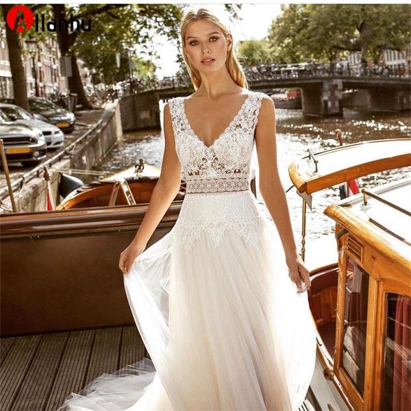 NOUVEAU! Robe De mariée exquise col en V profond sans manches en dentelle appliques robes De mariée sangle dos nu bouton étage longueur Robe De Mariee