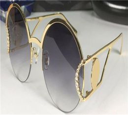 Nouvelles lunettes de soleil de design de mode 2094S Cadre de demi-cadre rond en métal avec tête de tas de diamant Populaire et généreux Top Protection 9356086