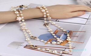 Collier de déclaration pour femme, nouvelle mode de luxe, élégant, fleurs, perles blanches, longue chaîne, pull, déclaration, 3992579