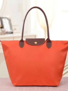 Nueva moda Simple y versátil bolso de hombro de gran capacidad bolso de mamá bolso de viaje de ocio para mujer bolso de bola de masa