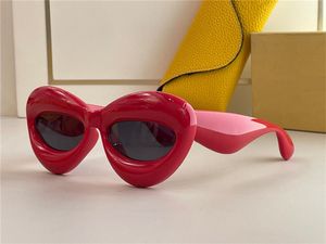 Nouvelle mode lunettes de soleil 40097 design spécial couleur lèvres forme cadre style avant-gardiste fou intéressant avec étui