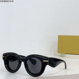 Nouvelles lunettes de soleil de mode Couleur de conception spéciale Forme des yeux de chat gonflé Cadre de planche acétate Style d'avant-garde folle intéressante avec le boîtier de qualité supérieure