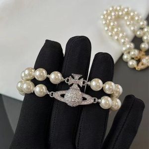 Nuevas pulseras con cuentas femeninas de moda Bracelets de la cadena de perlas Planeta Saturno Saturno Pearl Punk Fashion For Women Designer Jewelry Accessors