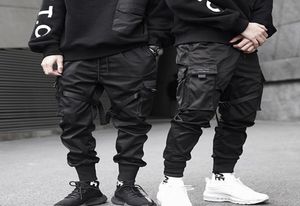 Nouveaux garçons hip hop Multipgies taille élastique Harem Pant Men Men Streetwear Punk pantalon Jogger Pantalon tactique masculin pantalon cargo noir L2418222