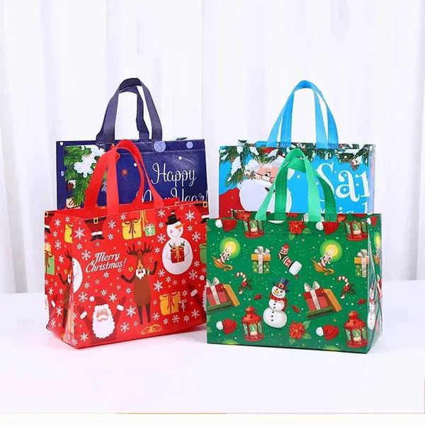 Nuevo en bolsas de regalo de Navidad Dibujos animados lindo Santa Elk Muñeco de nieve Impresión Bolso no tejido Prensado en caliente Suministros para fiestas al por mayor 220923