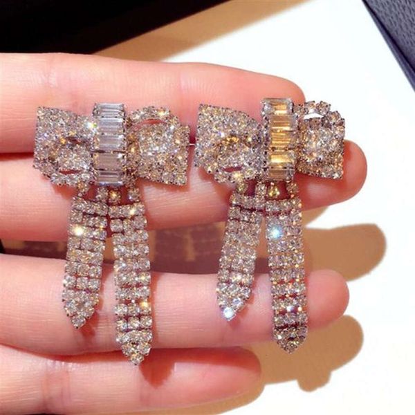 Nuevo estilo coreano Ins Fashion Diseñador de lujo Super Brilling Diamonds Circón Lindo Barnante de arco Pendientes para mujer