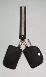 Nieuwe dames dubbele sleutel pouch polsklutiebagsontwerper portemonnee portemonnee kaarthouder munt portemonnee sleutelhanger nylon canvas portefeuilles