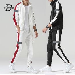 Nuevos hombres de moda con cremallera de manga larga chaqueta pantalones conjunto masculino chándal traje deportivo hombres gimnasios conjunto Casual Streetwear hombre ropa 201201