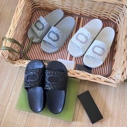 Nuevas hombres Mujeres zapatillas de diseño clásicos Interlocking Sandalias de toboganes de goma texturizados Negro Blanco Blanco Mensor Moda de lujo de lujo Slipper