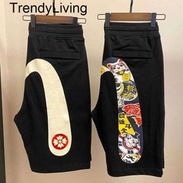 Nuevos pantos cortos para hombres delgados fushen estampado capris capris sports sports informales sobre la rodilla pierna ancha pantalones de verano grandes cortos