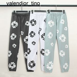 Nuevo diseñador de marca de moda para mujer para hombre Pantalones con estampado de flores para hombres y mujeres Pantalones de chándal negros con cordón Monos para hombre Pantalones de mujer