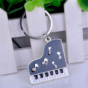 Nouveau symbole de musique Piano Pendant la chaîne de clés Anneau de voiture de mode pour femmes Bag de charme Ornement des dons de résidence en strass