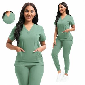 Nuevo uniforme de enfermera para mujeres Enfermería Bata quirúrgica sólida Conjuntos de fregado médico de alta calidad Ropa de trabajo hospitalaria unisex Precio al por mayor W0RP #