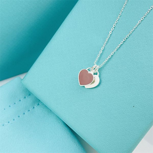 Nuevos collares pendientes en forma de corazón Diamante para mujer Titanio Acero Letra t Hombres Diseñador Regalo de lujo Cumpleaños Joyería para fiesta de boda