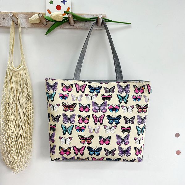 Nuevo bolso de mano para axila informal a la moda para mujer, de lona, estampado