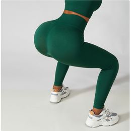 Nuovi pantaloni skinny da yoga senza cuciture Pantaloni da allenamento per esercizi di contrazione del ventre a vita alta da donna Leggings color pesca