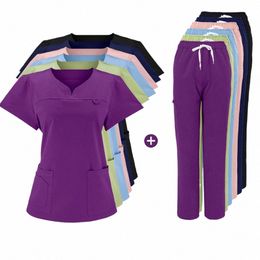 nieuwe nauwsluitende elasticiteit scrubs sets Operatiekamer Medische Uniform scrubs uniform verpleegster vrouwen Effen kleur Chirurgie Pak K1cU #