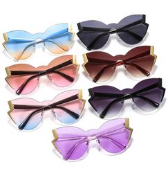 Nuevo especial Rimless Cateyes Sexy Women Gafas de sol novedadas grandes lentes de una sola vez con bares fulgurosos