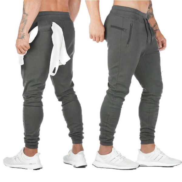 Nuevos pantalones colgantes de toalla deportiva para hombre, mallas de entrenamiento para correr