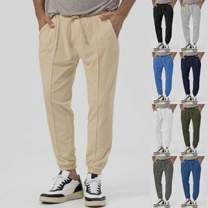 Nieuwe sportbroeken voor heren in herfst en winter, effen kleur casual sanitaire broek, loszittende legging, trend