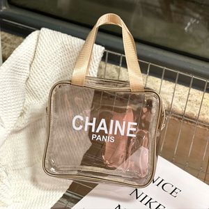 Nouveau style unisexe alphabet à main transparent anti-fruits gelée sac cosmétique sac de lavage à main plage fitness yoga