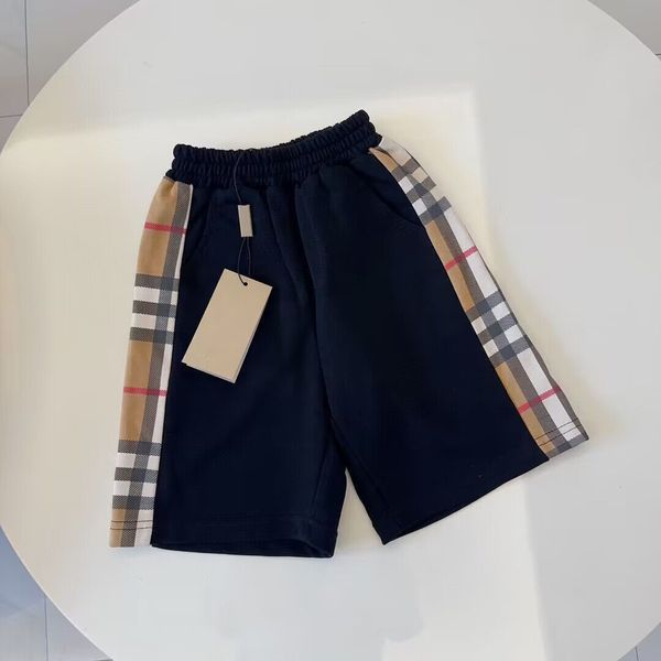 Nuevos pantalones cortos clásicos de verano a cuadros, pantalones, pantalones, versión coreana de moda casual, pantalones de vestir para niños, estilo extranjero.