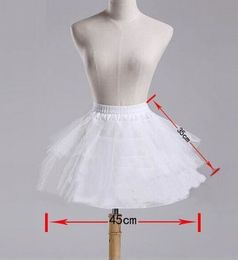 Jupon blanc de Crinoline courte d’A-ligne, jupon de robe de fille de fleur, jupe d’agitation, agitation désossée, jupon court de mariage de jupon