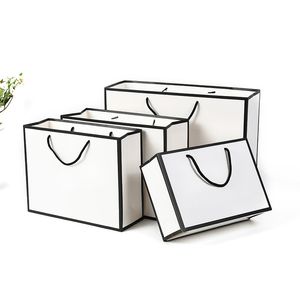 Bolsa de papel de regalo blanca con logotipo personalizable, bolsa de papel kraft con patrón artesanal, embalaje personalizado de negocios, venta al por mayor