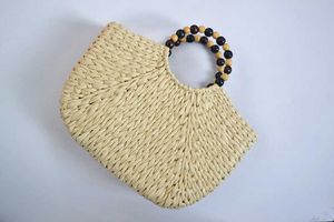 Nouveau sac tissé d'herbe d'été pour femmes fil d'or poignée de perle mélangée seau rond plage 240312