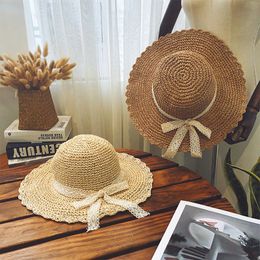 Nouveau femmes été bord de mer Protection UV chapeau de soleil dentelle décoratif arc chapeau de paille large bord disquette pliable voyage chapeau de plage