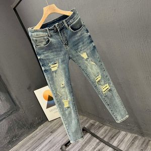 Jeans à neuf points pour les hommes avec des trous déchirés dans Instagram Trendy Elastic Slim Fit Version coréenne Youth Spring / Summer Washed 9 points Leggings